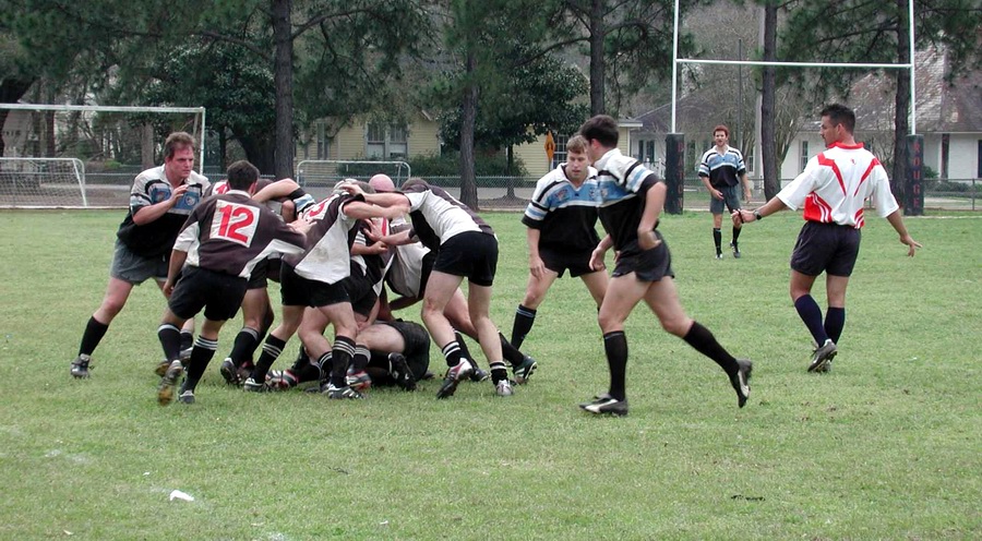 Forwards executing a ruck